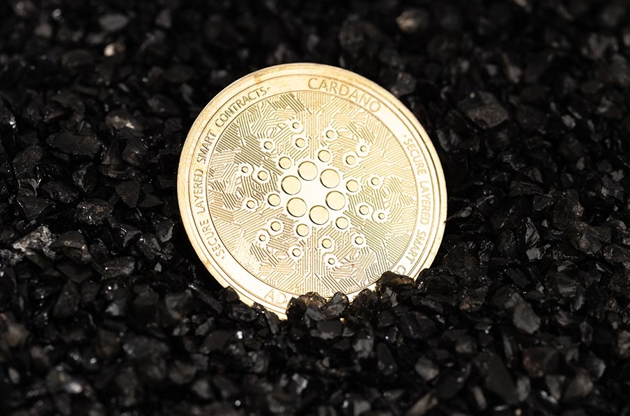 cardano-coin-on-black-gravel