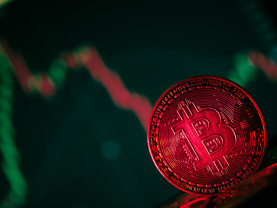 coins-with-bitcoin-symbol-on-red-light-and-crypto