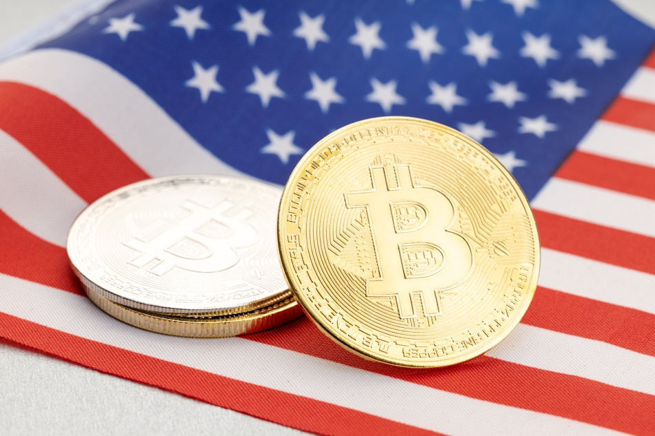 Bitcoin cryptocurrency coins on national flag of United States. Crypto law regulation concept