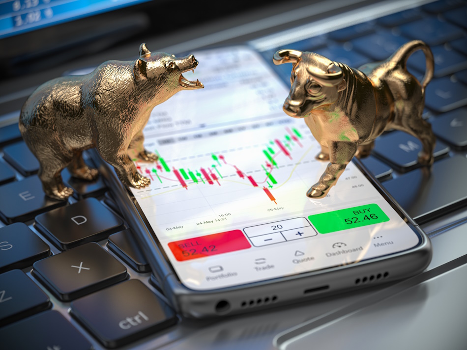 Golden bull and bear as symbols of stock market on a smartphone